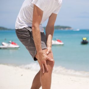 A male jogger, having severe pain on the lateral side of the knee at the beach