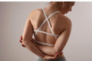 woman suffering from back and pain scoliosis posture correction picture id1205502355