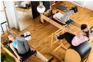 young women practicing pilates on reformer at gym picture id1312165479